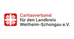 Neues Caritaslogo: weißes Flammenkreuz auf rotem Untergrund, rechts daneben der Schriftzug Caritas Weilheim Schongau in rot und schwarz
